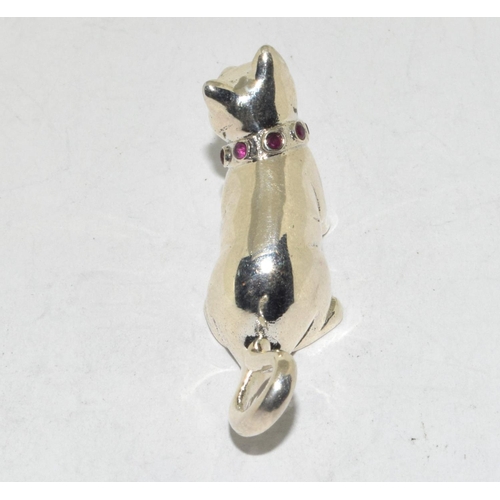 424 - A silver cat figure with ruby set collar.