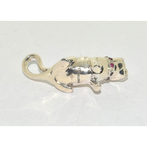 424 - A silver cat figure with ruby set collar.