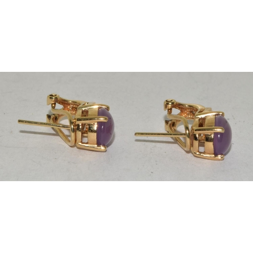 519 - A pair of 10ct yellow gold cabachon amethyst earrings.