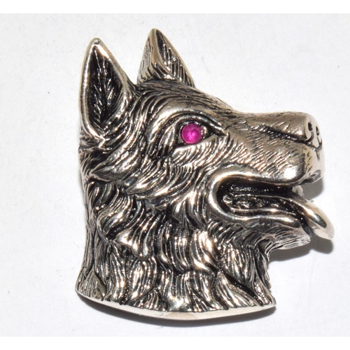 488 - A silver dog pendant/brooch with ruby eye