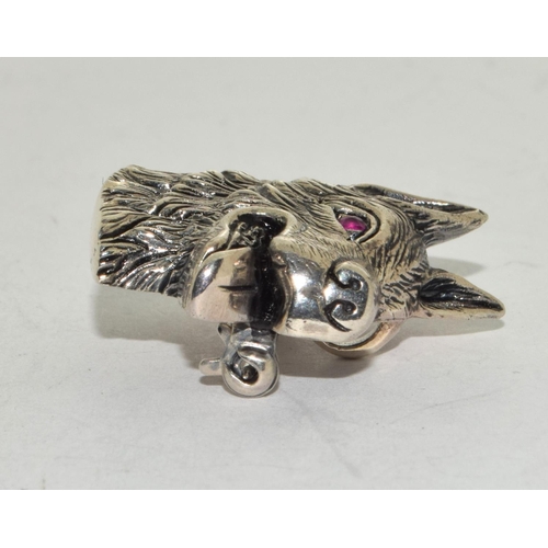 488 - A silver dog pendant/brooch with ruby eye