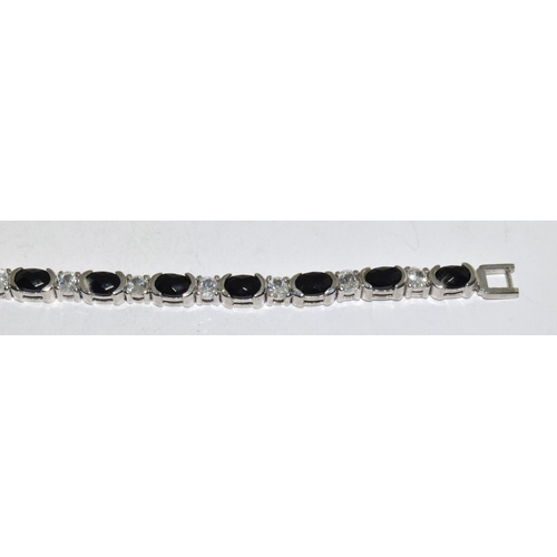 422 - A silver sapphire and CZ bracelet.