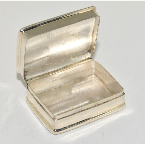 504 - A silver pill box with nude enamel image of a lady.