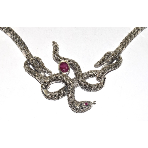 404 - A silver ruby set snake necklace.