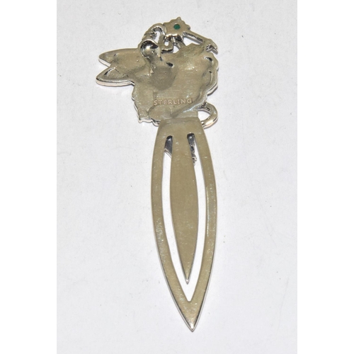 485 - A silver bookmark with fairy finial set with emerald cabochon