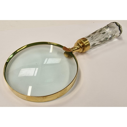 263 - A large brass hand held magnifying glass.