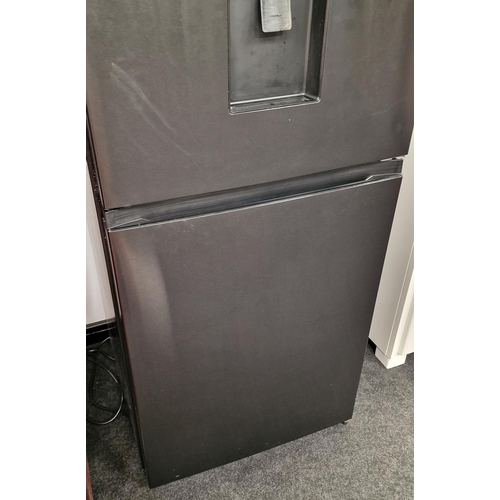 379 - A Hisense black modern fridge freezer. Looks to have been barely used.185x58x57cm.