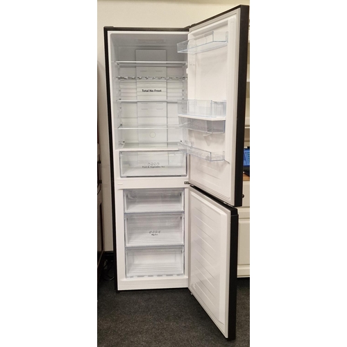 379 - A Hisense black modern fridge freezer. Looks to have been barely used.185x58x57cm.