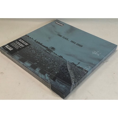 38 - OASIS SEALED BOXSET ‘TIME FLIES….1994 - 2009’. This is the complete Oasis singles collection pressed... 