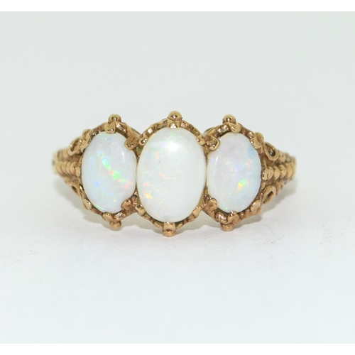 175 - 9ct gold ladies antique Opal trilogy ring in an ornate setting size Q