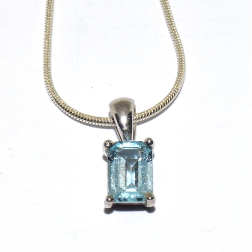 196 - Emerald cut blue topaz 925 silver pendant and earrings.