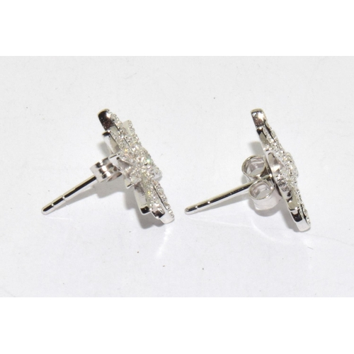 221 - A Pair of Silver and CZ Sunburst Style Stud Earrings