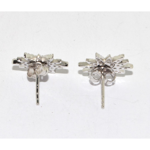 221 - A Pair of Silver and CZ Sunburst Style Stud Earrings