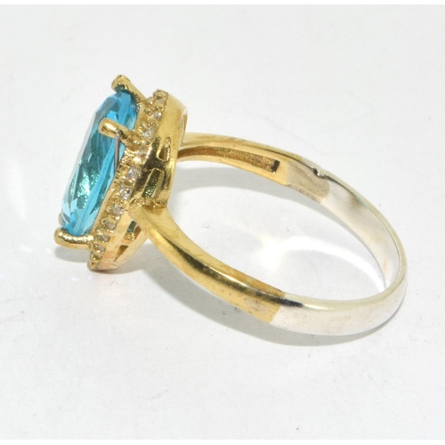 239 - A Single CZ and Pear Shaped Blue Topaz Ring