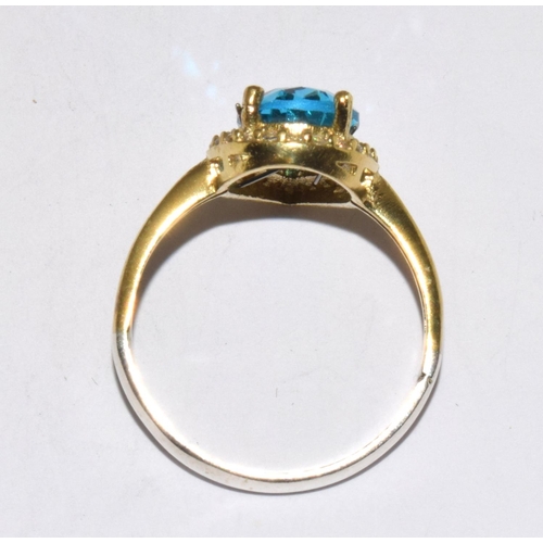 239 - A Single CZ and Pear Shaped Blue Topaz Ring