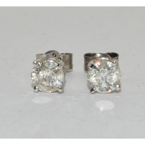 377 - A pair of 14CT W/G Diamond Stud Earrings of 1CT Approx.