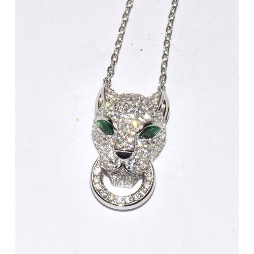 256 - Silver design leopard pendant necklace with emerald eyes