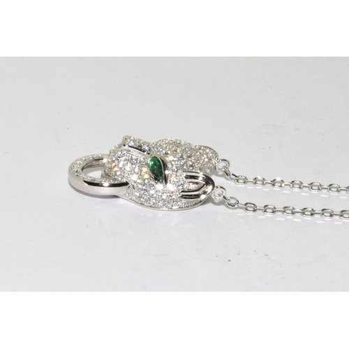 256 - Silver design leopard pendant necklace with emerald eyes