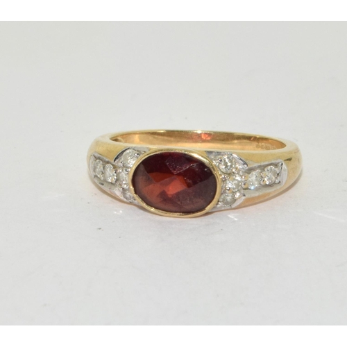 348 - 9ct gold ladies Diamond and Garnet ring size N