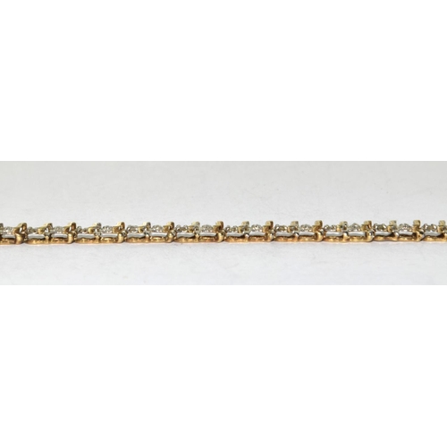 352 - 9ct gold and diamond insert tennis bracelet tight clasp and safety 7