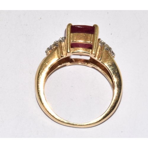 401 - 9ct gold ladies faceted Ruby and diamond shoulder ring size K