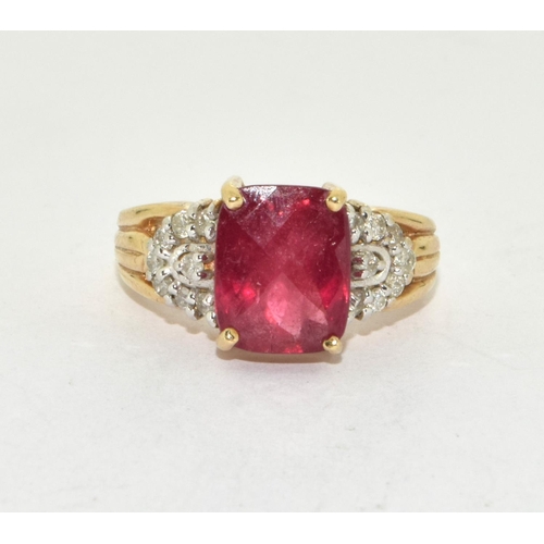 401 - 9ct gold ladies faceted Ruby and diamond shoulder ring size K