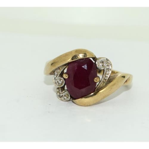 290 - 9ct gold ladies Diamond and Ruby by pass ring 4.2g size P