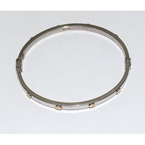 382 - 9ct white gold ladies bangle in the Cartier love bangle design