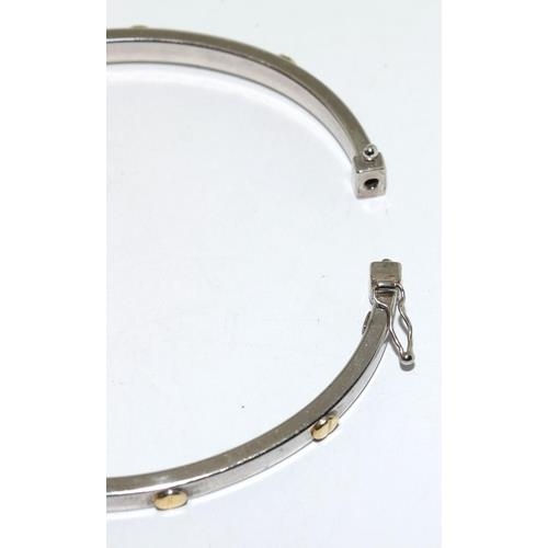 382 - 9ct white gold ladies bangle in the Cartier love bangle design