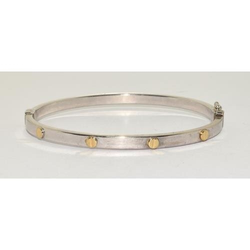 382 - 9ct white gold ladies bangle in the Cartier love bangle design