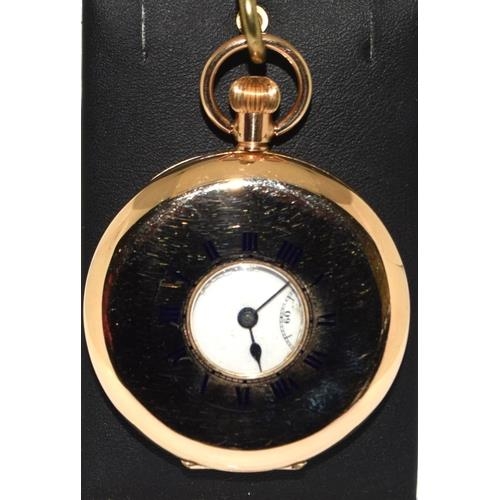 384 - 9ct gold side wind half hunter pocket watch set with enamel face and roman numerals with subsidiary ... 