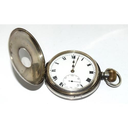 357 - Silver top wind  half hunter pocket watch 50mm, running when catalogued