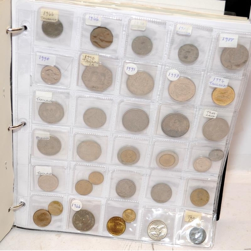 54 - Folder containing a large quantity of World coins. Alphabetically presented from Switzerland through... 