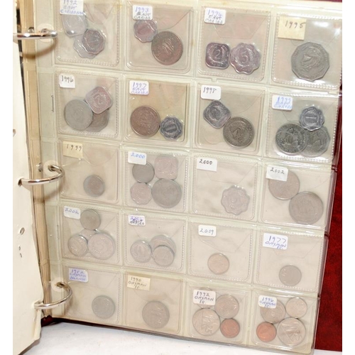 55 - Folder containing a large quantity of World coins. Alphabetically presented from Canada through to C... 