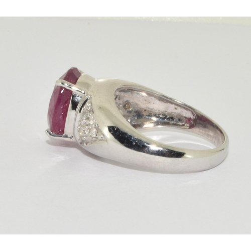 333 - An 18ct white gold ring  set with Large ruby centre stone and diamond set shoulders Size N