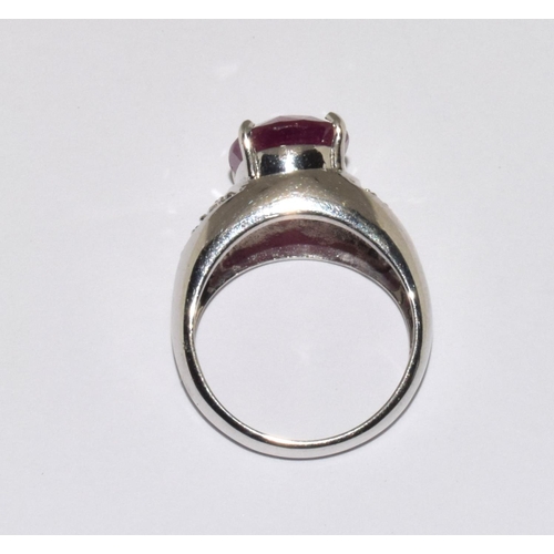 333 - An 18ct white gold ring  set with Large ruby centre stone and diamond set shoulders Size N