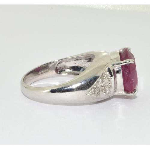 333 - An 18ct white gold ring  set with Large ruby centre stone and diamond set shoulders Size N