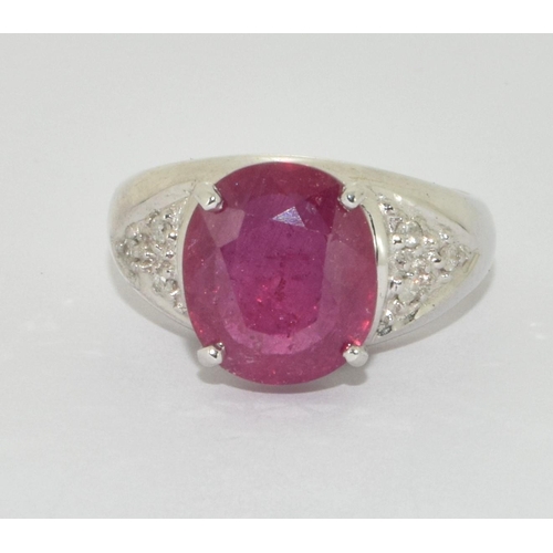 333 - An 18ct white gold ring  set with Large ruby centre stone and diamond set shoulders Size N