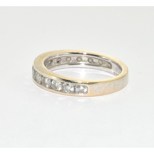 128 - An 18ct white gold and diamond half eternity ring, Size L, 4gm