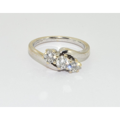 338 - An 18ct gold and diamond 3 stone ring Size L+, 4.6g