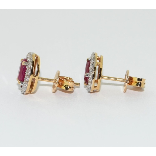 154 - A pair of Ruby/Diamond 18ct gold earrings.