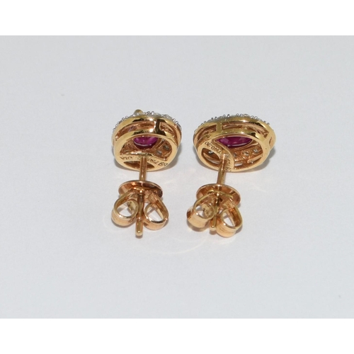 154 - A pair of Ruby/Diamond 18ct gold earrings.