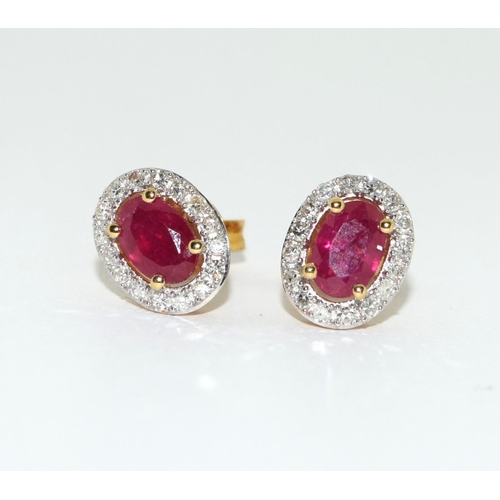 154 - A pair of Ruby/Diamond 18ct gold earrings.