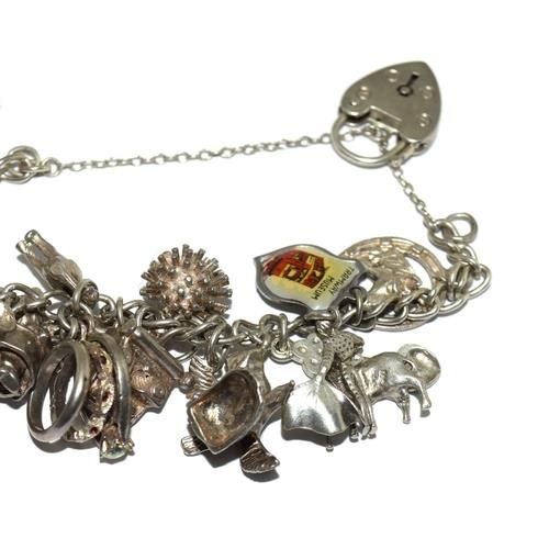 89 - Good silver charm bracelet and charms approx 25, 80g