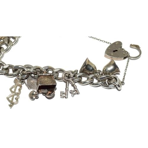 98 - Silver charm bracelet and charms (10) 53g