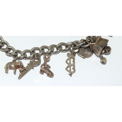 98 - Silver charm bracelet and charms (10) 53g