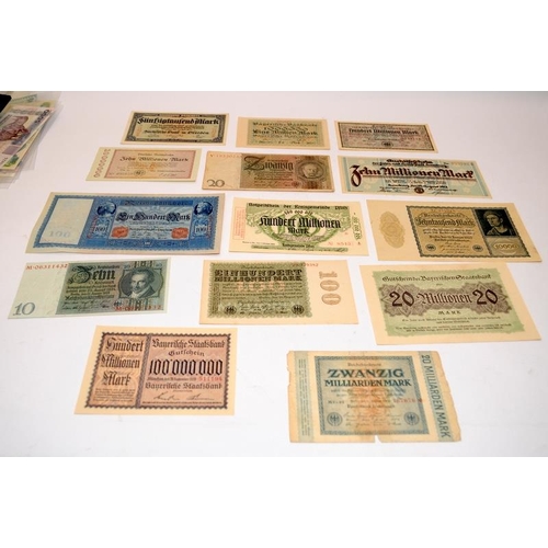 62 - A collection of vintage German banknotes to include high values. 14 notes in lot. Many in UNC condit... 