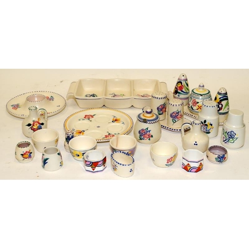 225 - A collection of Poole Pottery table accompaniments including condiments sets, egg cups, napkin rings... 