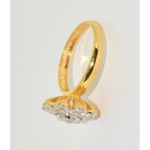 414 - An 18ct gold daisy ring, Approx 1.30ct, Size R