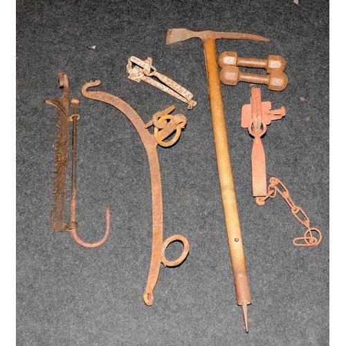 91 - A collection of antique metalware to include hanging scales, dumbells, and an icepick